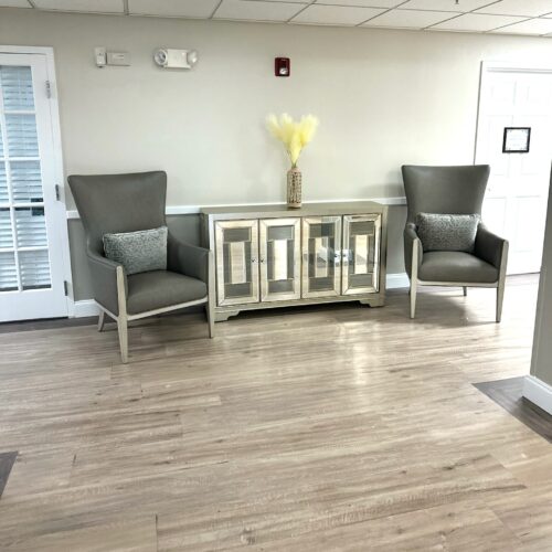 Hallway common area with two chairs